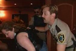 Television actors recreate a police raid for satiric effect.